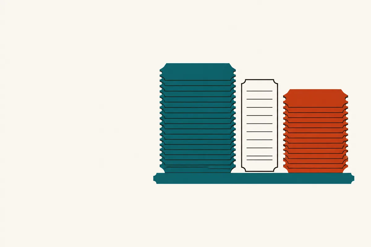 Two stacks of blank slips face each other across a gap, with one notched slip standing between them.